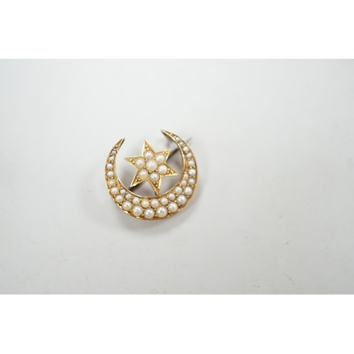 1951 - An Edwardian yellow metal and seed pearl set crescent moon and star brooch, 22mm, gross weight 4 gra... 