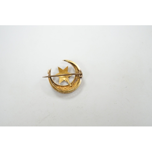 1951 - An Edwardian yellow metal and seed pearl set crescent moon and star brooch, 22mm, gross weight 4 gra... 