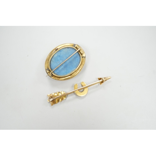 1958 - An early 20th century yellow metal, and seed pearl set arrow and horse shoe brooch, 60mm and a Victo... 