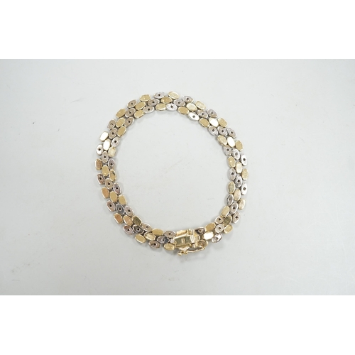 1961 - A modern two colour 585 and diamond chip set bracelet, 18cm, gross weight 17.3 grams.