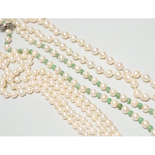 1963 - A Mikimoto single strand cultured pearl and green quartz? bead necklace, with white metal and cultur... 