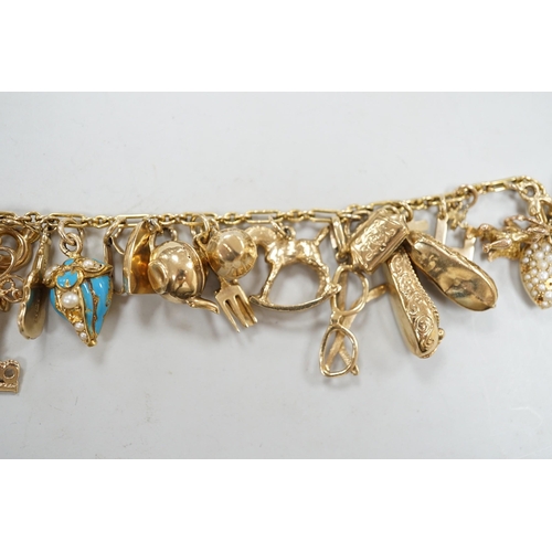 1972 - A 9ct charm bracelet, hung with assorted mainly 9ct gold charms, gross weight 46.1 grams.