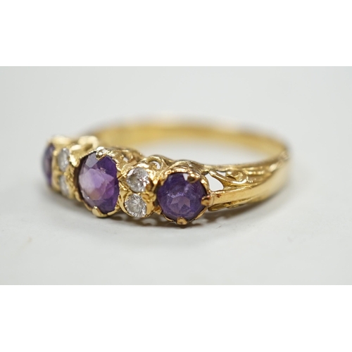 1974 - An 18ct, three stone amethyst and four stone diamond set half hoop ring, size Q/R, gross weight 4 gr... 