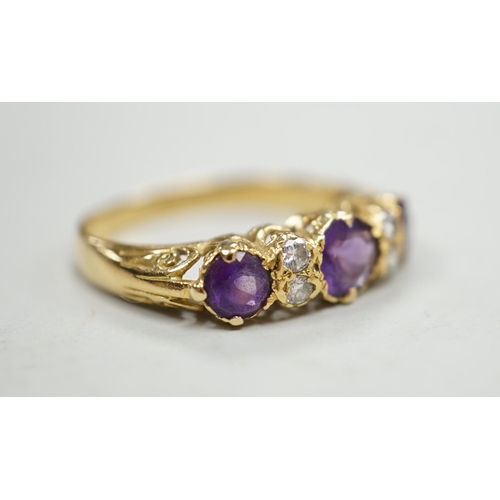 1974 - An 18ct, three stone amethyst and four stone diamond set half hoop ring, size Q/R, gross weight 4 gr... 