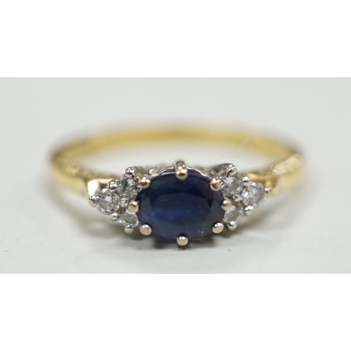 1975 - A modern 18ct gold, single stone sapphire and six stone diamond chip set ring, size O/P, gross weigh... 