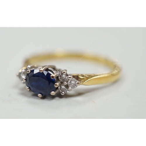 1975 - A modern 18ct gold, single stone sapphire and six stone diamond chip set ring, size O/P, gross weigh... 