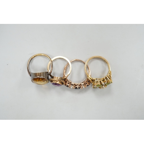 1976 - An 18ct gold and citrine set oval ring, size M/N, gross weight 5.8 grams and three assorted 9ct and ... 