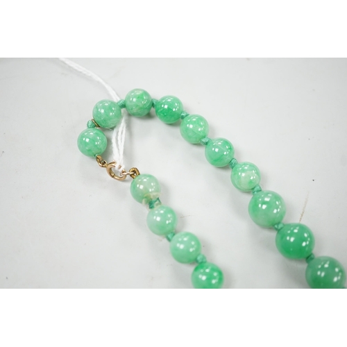 994 - A single strand jade bead necklace, 58cm, gross weight 91 grams.