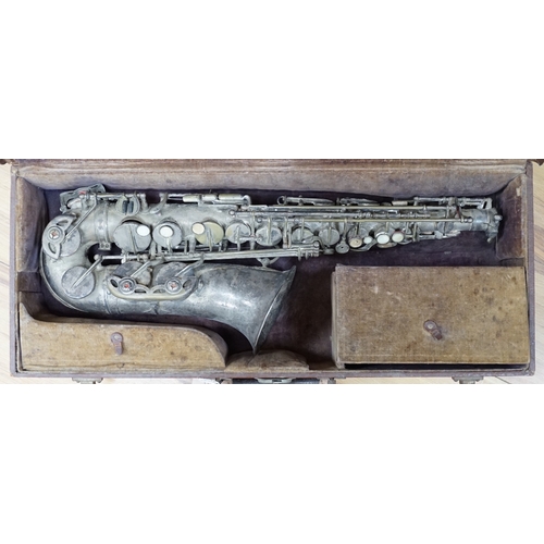 623A - A cased saxophone marked ‘Lark, Shanghai, China M4021’