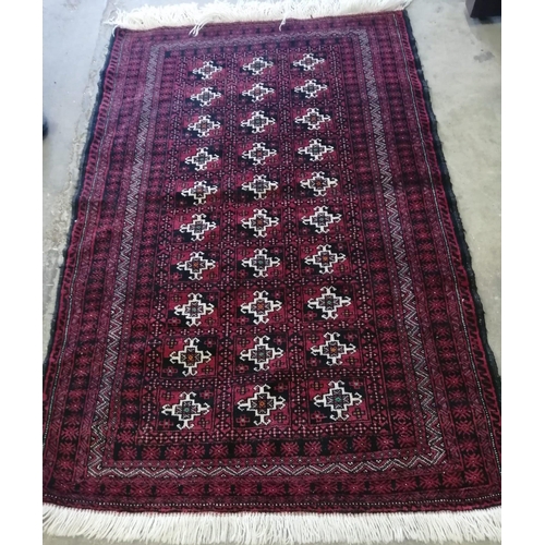 10 - A Bokhara burgundy ground rug, 164 x 110cm *Please note the sale commences at 9am.