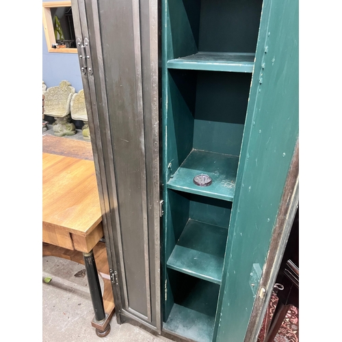 100 - An Indian style metal two door cupboard, width 60cm, depth 41cm, height 186cm *Please note the sale ... 