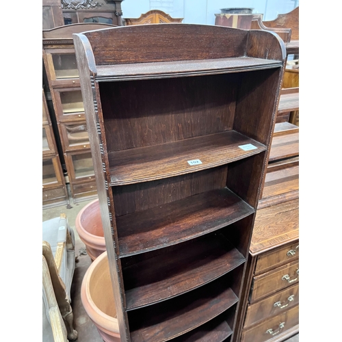 102 - A 1920's oak narrow eight shelf open bookcase, width 49cm, depth 30cm, height 161cm *Please note the... 