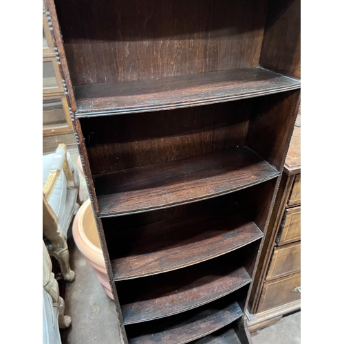 102 - A 1920's oak narrow eight shelf open bookcase, width 49cm, depth 30cm, height 161cm *Please note the... 