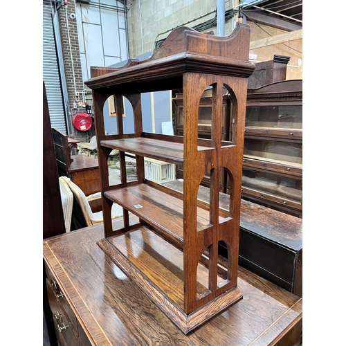 103 - An Edwardian oak table top four tier open bookcase, width 62cm, depth 23cm, height 81cm *Please note... 