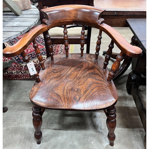 111 - A Victorian style elm and beech smoker's bow chair, width 69cm, depth 50cm, height 82cm *Please note... 