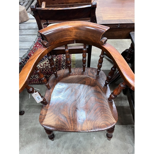 111 - A Victorian style elm and beech smoker's bow chair, width 69cm, depth 50cm, height 82cm *Please note... 