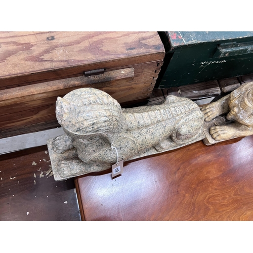 119 - A pair of composition faux marble sphinx, length 48cm, height 30cm *Please note the sale commences a... 