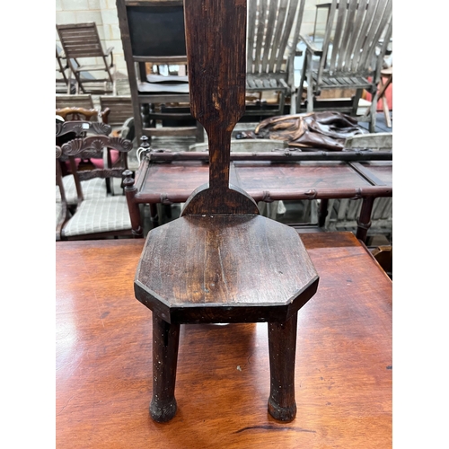 125 - A carved oak spinning chair, height 82cm *Please note the sale commences at 9am.