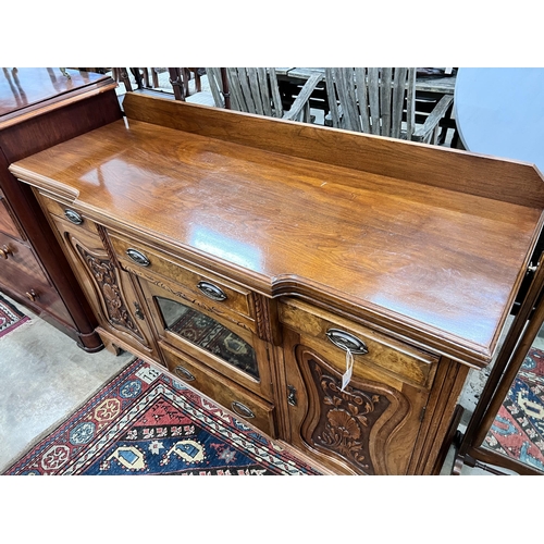 129 - A late Victorian carved walnut breakfront sideboard, length 153cm, depth 52cm, height 107cm *Please ... 