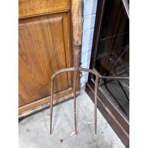 13 - A provincial wrought iron and wood pitchfork, length 175cm *Please note the sale commences at 9am.... 