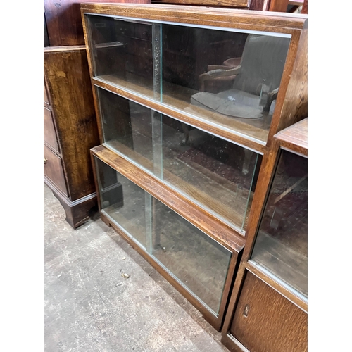 139 - Five 1960's oak Minty bookcases comprising two four section, one three section, and a near pair of t... 