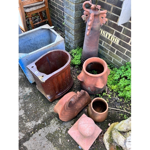 143 - Six assorted terracotta and earthenware planters and ornaments *Please note the sale commences at 9a... 