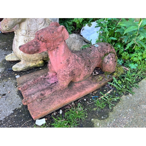 146 - A terracotta recumbent greyhound garden ornament, height 40cm *Please note the sale commences at 9am... 