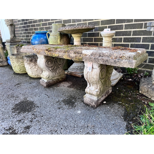 155 - A reconstituted stone garden bench, length 128cm, depth 37cm, height 45cm *Please note the sale comm... 