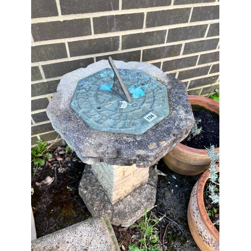 156 - An octagonal reconstituted stone sundial on brick effect pillar, height 75cm *Please note the sale c... 