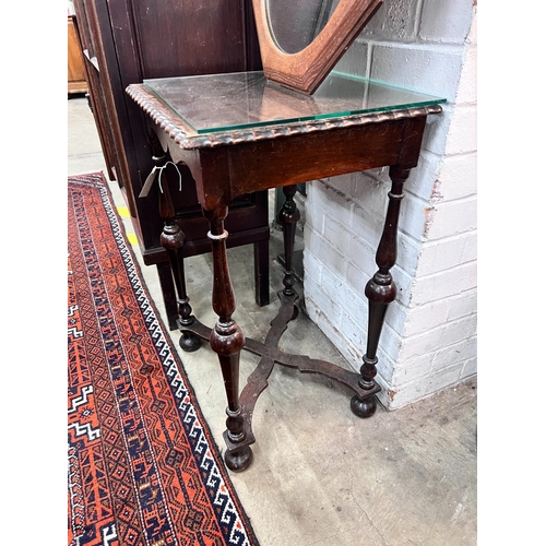 16 - A 1920's mahogany side table, width 45cm, height 70cm, together with an octagonal oak framed wall mi... 