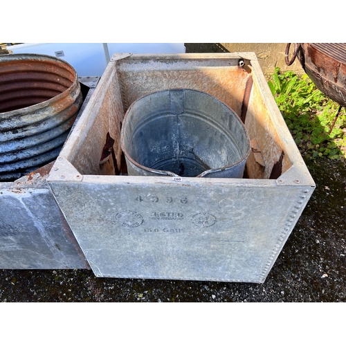 160 - A large rectangular galvanised tank, width 107cm, depth 84cm, height 72cm together with an oval galv... 