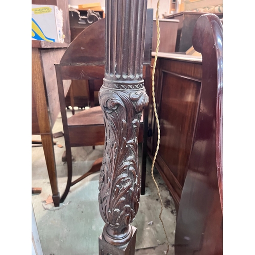 17 - A carved oak and mahogany carved standard lamp, height 151cm *Please note the sale commences at 9am.... 