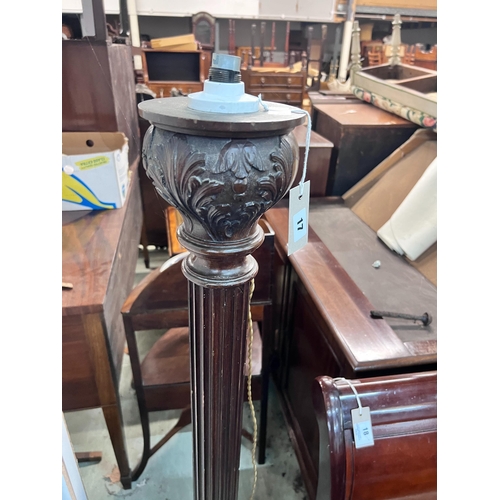 17 - A carved oak and mahogany carved standard lamp, height 151cm *Please note the sale commences at 9am.... 