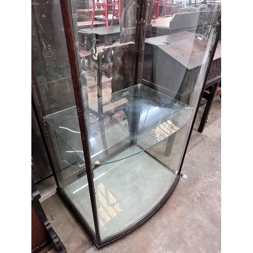 179 - A late Victorian mahogany bowfront shop display cabinet, width 84cm, depth 58cm, height 196cm *Pleas... 