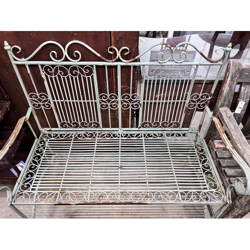 183 - A painted wrought iron folding garden bench, width 108cm *Please note the sale commences at 9am.... 