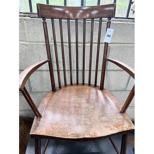 192 - An Arts & Crafts beech Windsor comb back elbow chair, width 49cm, depth 41cm, height 86cm *Please no... 