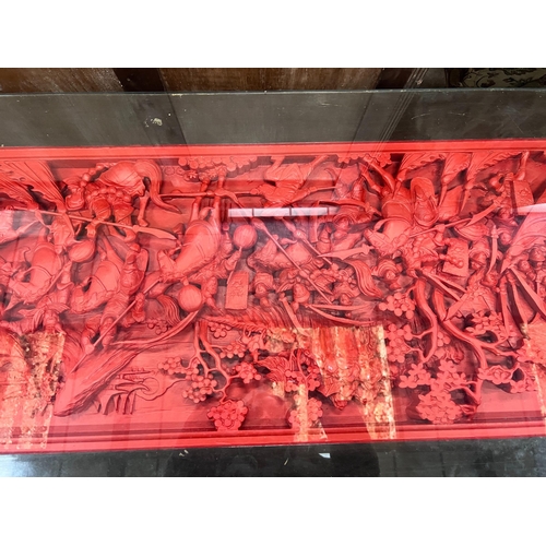 230 - An Asian red stained hardwood coffee table, length 142cm *Please note the sale commences at 9am.... 