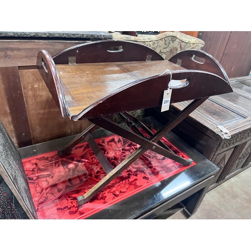 231 - A mahogany butler's tray on folding stand, width 70cm *Please note the sale commences at 9am.