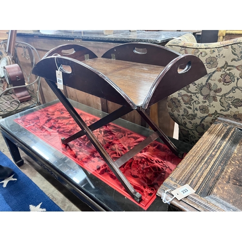 231 - A mahogany butler's tray on folding stand, width 70cm *Please note the sale commences at 9am.