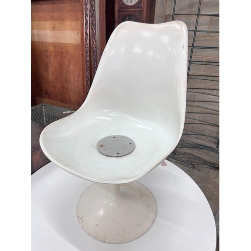 255 - A small mid century white melamine topped Tulip design table, 101cm, and a single matching chair *... 