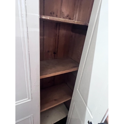 258 - A white painted pine housekeeper's cupboard, width 99cm, height 210cm *Please note the sale commence... 