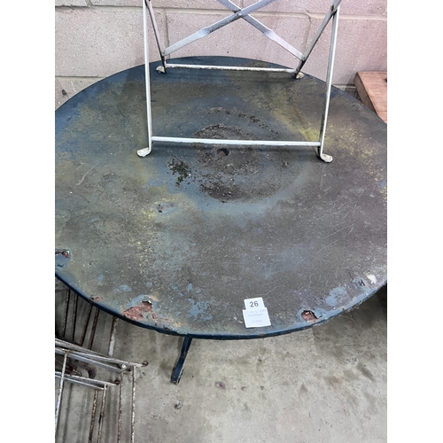 26 - A circular metal and wrought iron garden table, diameter 90cm and three chairs *Please note the sale... 