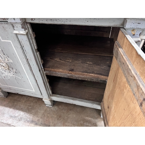 269 - A continental painted pine low cupboard, width 125cm *Please note the sale commences at 9am.