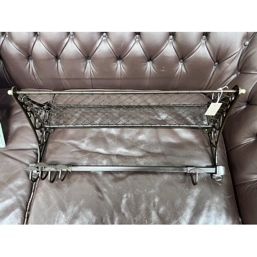 280 - A bronzed metal wall hanging coat rack, width 75cm *Please note the sale commences at 9am.