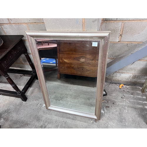 288 - A silvered wood framed wall mirror, width 74cm, height 105cm *Please note the sale commences at 9am.... 