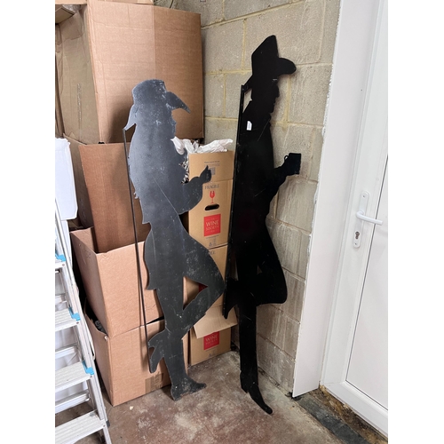 301 - A pair of black painted iron silhouettes of cowboys, largest 177cm *Please note the sale commences a... 