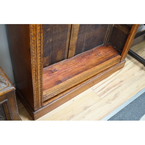 318 - A late Victorian carved oak open bookcase, width 106cm *Please note the sale commences at 9am.... 