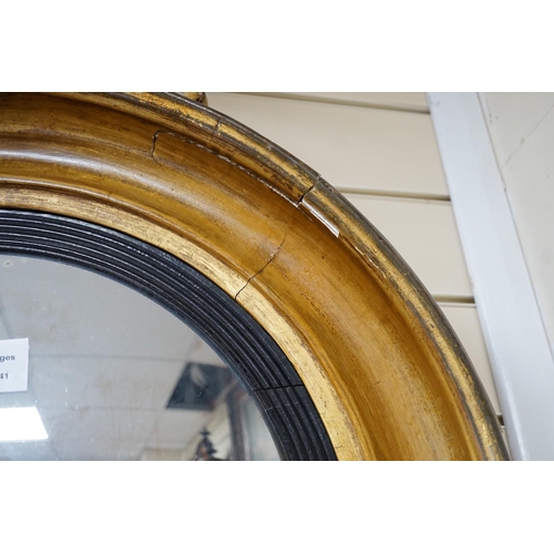 322 - A Regency ebonised and giltwood convex wall mirror, height 87cm *Please note the sale commences at 9... 