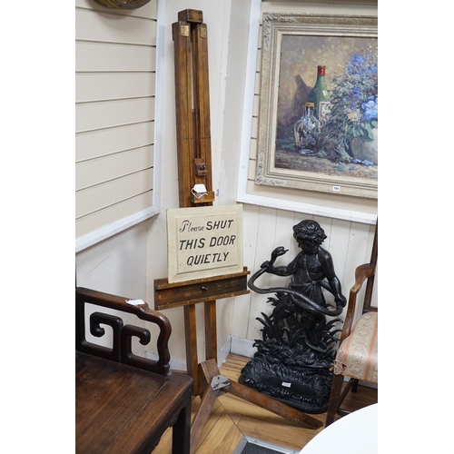 323 - A beech artist's easel, height 170cm, with a door shutting sign *Please note the sale commences at 9... 