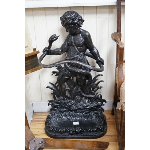 324 - A Victorian style black painted cast iron infant Hercules stick stand in the Coalbrookdale style, he... 